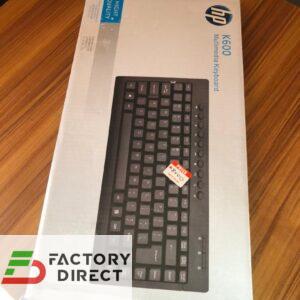 Front view of HP K600 Multimedia Keyboard box showing compact black layout and multimedia icons.